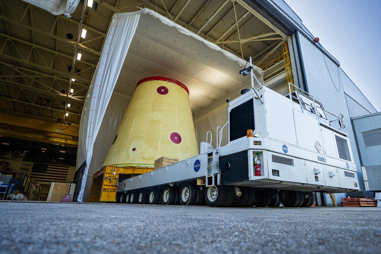 NASA rolled out a key piece of space flight hardware for the SLS (Space Launch System) rocket for the first crewed mission of NASA’s Artemis campaign from Marshall Space Flight Center in Huntsville, Alabama, on Wednesday, Aug. 21 for shipment to the agency’s spaceport in Florida. The cone-shaped launch vehicle stage adapter connects the rocket’s core stage to the upper stage and helps protect the upper stage’s engine that will help propel the Artemis II test flight around the Moon, slated for 2025. Manufactured by prime contractor Teledyne Brown Engineering and the Jacobs Space Exploration Group’s ESSCA (Engineering Services and Science Capability Augmentation) contract using NASA Marshall’s self-reacting friction-stir robotic and vertical weld tools. Crews moved the adapter out of NASA Marshall’s Building 4708 to the agency’s Pegasus barge Aug. 21. The barge will ferry the adapter first to NASA’s Michoud Assembly Facility in New Orleans, where crews will pick up additional SLS hardware for future Artemis missions, before traveling to NASA Kennedy. Once in Florida, the adapter will join the recently delivered core stage. There, teams with NASA’s Exploration Ground Systems will prepare the adapter for stacking and launch.